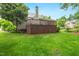 Lush backyard with a wooden deck, offering a perfect space for relaxation and outdoor activities at 2030 Prairie Ridge Ct, Fuquay Varina, NC 27526