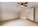 Bedroom with carpet, ceiling fan, and stairs leading down to the main floor at 2030 Prairie Ridge Ct, Fuquay Varina, NC 27526