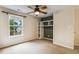 Bedroom features a built-in shelving unit and a large window at 2030 Prairie Ridge Ct, Fuquay Varina, NC 27526
