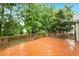 Spacious wooden deck overlooking lush greenery and a well-maintained lawn at 2030 Prairie Ridge Ct, Fuquay Varina, NC 27526