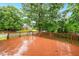 Wooden deck with a view of a quiet residential street and mature trees at 2030 Prairie Ridge Ct, Fuquay Varina, NC 27526