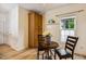 Cozy dining area with a round table, wooden chairs, and a view of the backyard, perfect for Gathering meals at 2030 Prairie Ridge Ct, Fuquay Varina, NC 27526