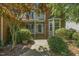 Close-up of front porch with brick steps and landscaped walkway leading to home entrance at 2030 Prairie Ridge Ct, Fuquay Varina, NC 27526