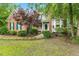 Charming brick home with manicured landscaping, enhancing its curb appeal and inviting atmosphere at 2030 Prairie Ridge Ct, Fuquay Varina, NC 27526