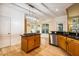 Open concept kitchen with a central island, modern lighting, and stainless steel appliances at 2030 Prairie Ridge Ct, Fuquay Varina, NC 27526