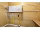 Practical laundry room with shelving and countertop space at 2030 Prairie Ridge Ct, Fuquay Varina, NC 27526