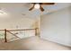 Spacious loft area with railing overlooking the floor below at 2030 Prairie Ridge Ct, Fuquay Varina, NC 27526