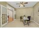 Home office with French doors, textured walls, and ceiling fan at 2030 Prairie Ridge Ct, Fuquay Varina, NC 27526