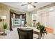 Bright office with bay window, ceiling fan and French door leading to another room at 2030 Prairie Ridge Ct, Fuquay Varina, NC 27526
