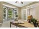 Bright office with books, globe, and view to backyard at 2030 Prairie Ridge Ct, Fuquay Varina, NC 27526