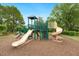 Community playground with climbing structure, slides, and play area for  at 2030 Prairie Ridge Ct, Fuquay Varina, NC 27526