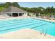 Bright community pool with lap lanes, a covered seating area, and ample lounge chairs at 2030 Prairie Ridge Ct, Fuquay Varina, NC 27526