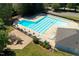 Aerial view of the community pool, playground, lounge chairs and tables at 2030 Prairie Ridge Ct, Fuquay Varina, NC 27526