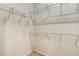 Spacious walk-in closet with ample shelving for organization and storage at 2030 Prairie Ridge Ct, Fuquay Varina, NC 27526