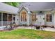 Charming back patio with a fire pit, seating area, and access to a screened-in porch, perfect for entertaining at 204 Middlestone Ct, Wake Forest, NC 27587