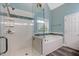 Modern bathroom featuring a glass-enclosed shower, soaking tub, and stylish design at 204 Middlestone Ct, Wake Forest, NC 27587