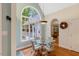 Charming breakfast nook features backyard views, a glass table and comfortable, stylish chairs at 204 Middlestone Ct, Wake Forest, NC 27587