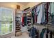 Organized walk-in closet with ample storage space, shelving and natural light from the window at 204 Middlestone Ct, Wake Forest, NC 27587