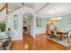 Open-concept dining area featuring hardwood floors and seamless flow to living room at 204 Middlestone Ct, Wake Forest, NC 27587