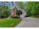 Side exterior of home with well-maintained lawn and concrete driveway at 204 Middlestone Ct, Wake Forest, NC 27587