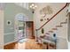 Grand foyer with hardwood floors, staircase, and an arched window with lots of light at 204 Middlestone Ct, Wake Forest, NC 27587
