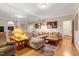Spacious living room with a comfortable sectional sofa, hardwood floors, and natural light at 204 Middlestone Ct, Wake Forest, NC 27587