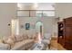 Comfortable living room with a staircase, neutral decor, and vaulted ceilings at 204 Middlestone Ct, Wake Forest, NC 27587