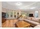 Large living room with ample natural light, comfortable seating, and access to the outdoors at 204 Middlestone Ct, Wake Forest, NC 27587