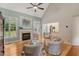 Cozy living room featuring a fireplace, hardwood floors, and large windows at 204 Middlestone Ct, Wake Forest, NC 27587