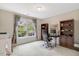 Home office featuring a large window with a view of the yard and built-in shelving at 204 Middlestone Ct, Wake Forest, NC 27587
