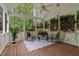 Screened porch with wood flooring, ceiling fan and outdoor seating at 204 Middlestone Ct, Wake Forest, NC 27587