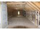 Large unfinished attic space with plywood flooring and HVAC at 2112 Coy St, Burlington, NC 27215