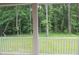 Enjoy beautiful wooded views from this home's spacious screened-in back porch at 2112 Coy St, Burlington, NC 27215
