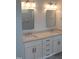 Bathroom featuring double sinks, granite countertops, and modern fixtures at 2112 Coy St, Burlington, NC 27215