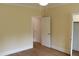 Bedroom with hardwood floors and an open white door at 2112 Coy St, Burlington, NC 27215