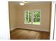 A bedroom with wood floor, ceiling fan and 2 windows at 2112 Coy St, Burlington, NC 27215