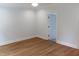 Spacious bedroom with light blue walls, wood floors, and white trim accents at 2112 Coy St, Burlington, NC 27215