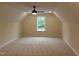 A spacious bedroom with tan carpet and a ceiling fan offers comfort at 2112 Coy St, Burlington, NC 27215