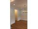 Dining room featuring wood floors, elegant lighting, and wainscoting at 2112 Coy St, Burlington, NC 27215