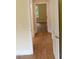 A hallway with wood floors and doors at 2112 Coy St, Burlington, NC 27215