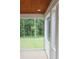 A screened porch with wood ceiling provides a tranquil view of the backyard at 2112 Coy St, Burlington, NC 27215