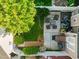 Aerial view of a landscaped backyard patio with seating, lawn, and manicured landscaping at 2503 Saint Pauls Sq, Raleigh, NC 27614