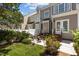 Townhome backyard with patio, chairs, and well-maintained lawn with landscaping at 2503 Saint Pauls Sq, Raleigh, NC 27614