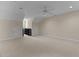 Open bonus room with neutral carpeting, a ceiling fan, dormer windows, and convenient access doors at 2503 Saint Pauls Sq, Raleigh, NC 27614