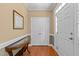 Welcoming foyer featuring hardwood floors, elegant trim, and natural light from the front door at 2503 Saint Pauls Sq, Raleigh, NC 27614