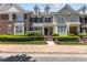 Charming townhome with a manicured lawn, brick accents, and a welcoming front porch with brick steps at 2503 Saint Pauls Sq, Raleigh, NC 27614