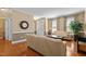 Spacious living room with hardwood floors, neutral paint, large windows, and ample seating at 2503 Saint Pauls Sq, Raleigh, NC 27614