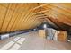 Bright unfinished attic space with natural light showcasing the roof's wooden frame at 2721 Cameron Pond Dr, Cary, NC 27519
