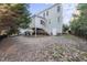 Exterior shot of the backyard with a white fence and deck at 2721 Cameron Pond Dr, Cary, NC 27519