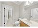 Updated bathroom featuring a wood vanity with white countertops, and updated fixtures at 2721 Cameron Pond Dr, Cary, NC 27519